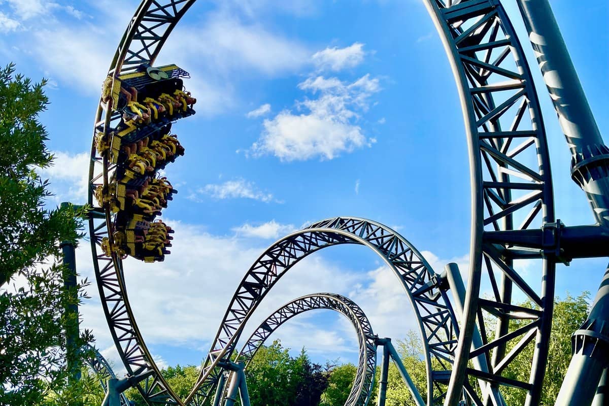 Thrill rollercoaster ride experience in theme park